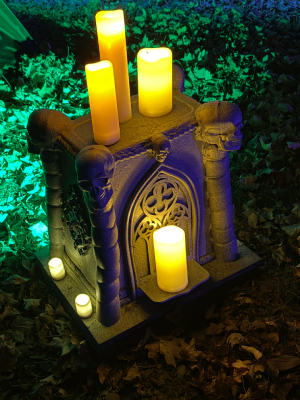 A small gothic altar lit by candles.