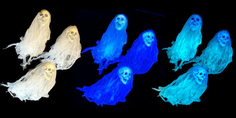 Three graveyard spirits in regular light, blacklight, and the dark in which they glow.