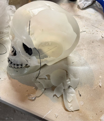 A glow in the dark skull cracked and crumbling.