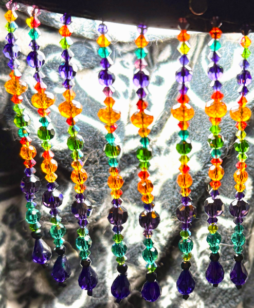 Beaded fringe in oranges, greens, and purples.